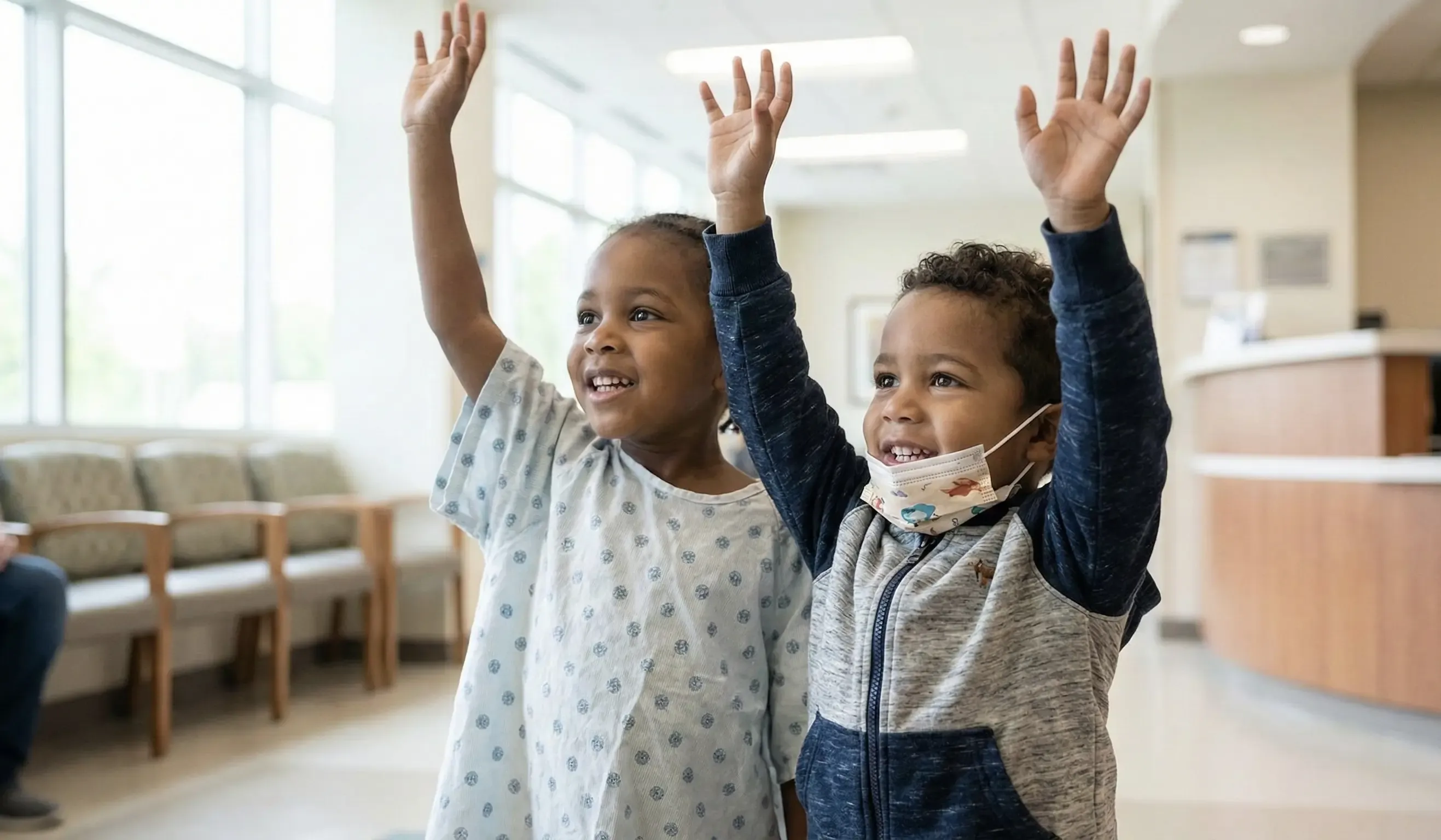 Children waving hands during shared activities