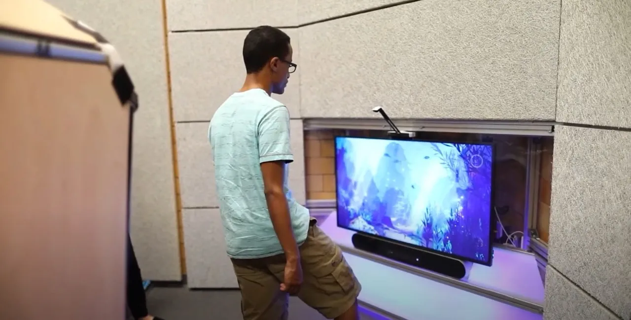 Students using the Ouva interactive sensory wall in a school sensory room.